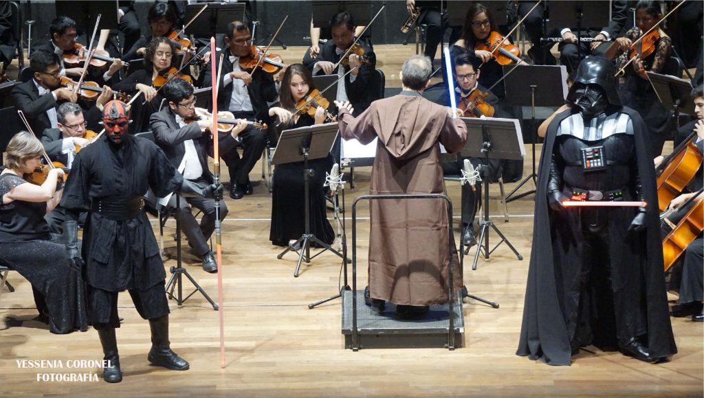 Mientras la Orquesta Sinfónica Nacional es dirigida por el maestro “Jedi” de la música; los niños, jóvenes y adultos quedan cautivados por la fuerza oscura de Star Wars…¡No es ficción sino realidad!
